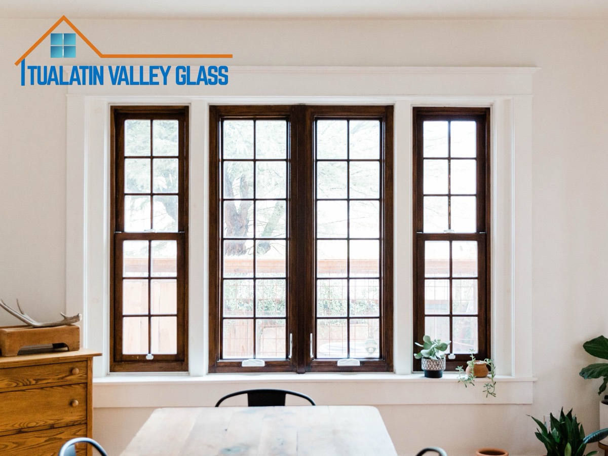 New wood-framed casement windows installed in a craftsman home